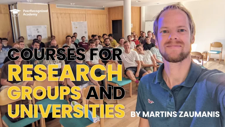 Martins Zaumanis with a class of students and the sign "Courses for Research Groups and Universities"